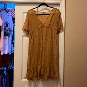 Camel brown dress with white polka dots.